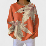 Manon – Orange Jumper with Autumn Leaf Design